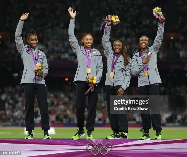 Gold medalists Tianna Madison, Allyson Felix, Bianca Knight and Carmelita Jeter of the United States pose on the podium during the medal ceremony for...