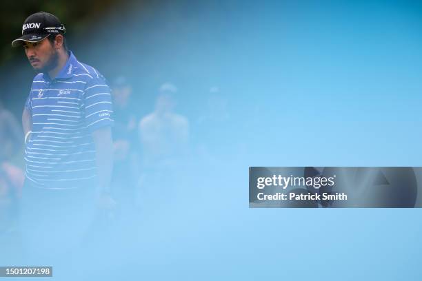 Hideki Matsuyama of Japan waits on the fourth green during the third round of the Travelers Championship at TPC River Highlands on June 24, 2023 in...