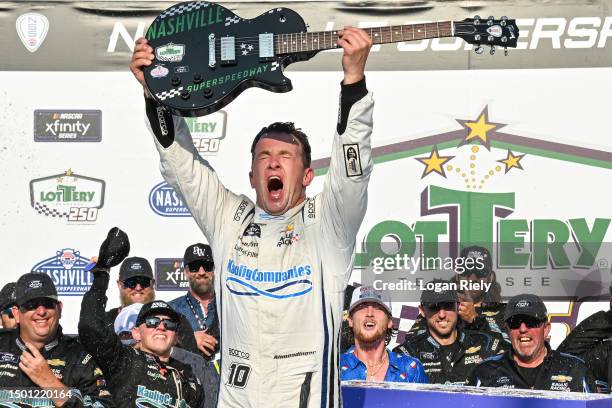 Allmendinger, driver of the Bailey Zimmerman - Religiously Chevrolet, celebrates in victory lane after winning the NASCAR Xfinity Series Tennessee...