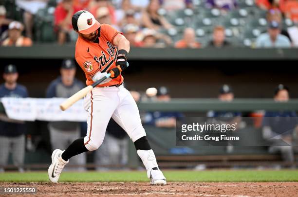 Ryan McKenna of the Baltimore Orioles hits a game-winning two-run home run in the tenth inning against the Seattle Mariners at Oriole Park at Camden...