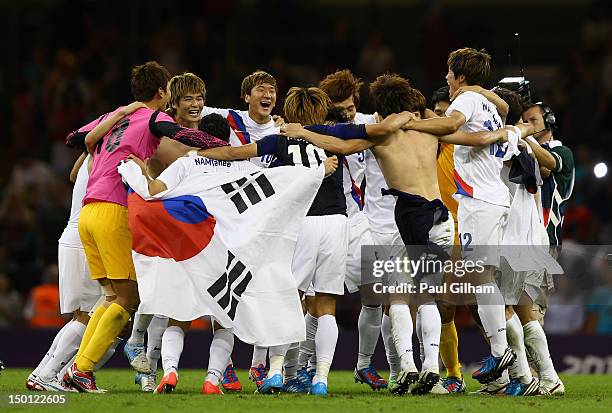 Korea celebrate winning the Men's Football Bronze medal play-off match between Korea and Japan on Day 14 of the London 2012 Olympic Games at...