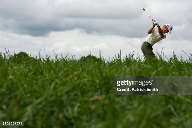 Eric Cole of the United States plays his shot from the 11th tee during the third round of the Travelers Championship at TPC River Highlands on June...