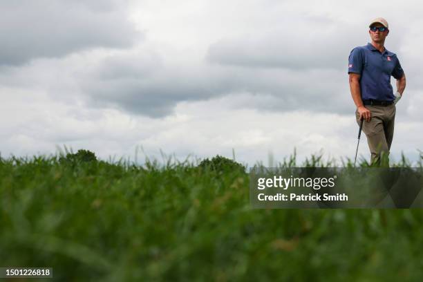 Adam Scott of Australia waits to play his shot from the 11th tee during the third round of the Travelers Championship at TPC River Highlands on June...