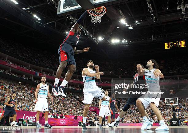 LeBron James of United States goes up for a dunk over Carlos Delfino of Argentina in the second half during the Men's Basketball semifinal match on...