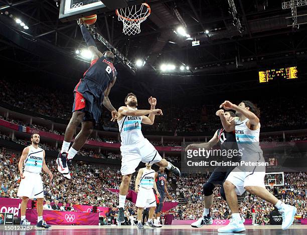 LeBron James of United States goes up for a dunk over Carlos Delfino of Argentina in the second half during the Men's Basketball semifinal match on...