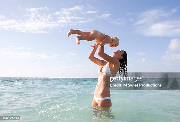 beach fun - mexican and white baby stock pictures, royalty-free photos & images