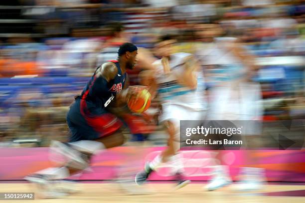 LeBron James of United States moves the ball against Carlos Delfino of Argentina during the Men's Basketball semifinal match on Day 14 of the London...