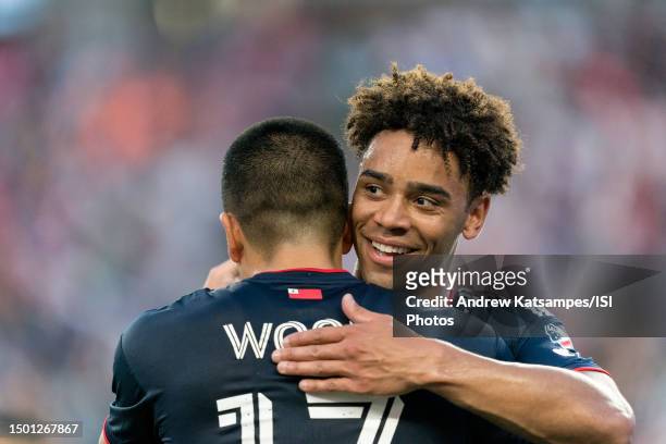 Bobby Wood of New England Revolution celebrates his goal with a teammate in the first half of a game against Toronto FC at Gillette Stadium on June...