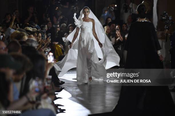 Models present creations by Stephane Rolland during the Women's Haute-Couture Fall/Winter 2023/2024 Fashion Week in Paris on July 4, 2023.