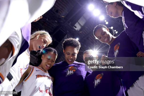 Brittney Griner and Diana Taurasi of the Phoenix Mercury gather their teammates before the game against the Seattle Storm at Climate Pledge Arena on...