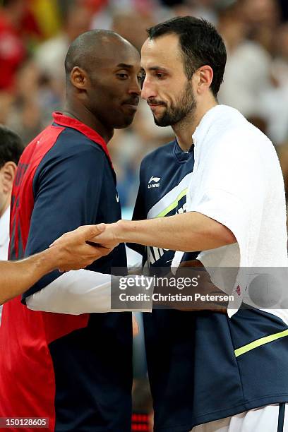 Kobe Bryant of United States and Manu Ginobili of Argentina shakes hands after the United States defeats Argentina 109-83 during the Men's Basketball...