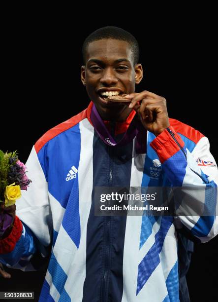 Bronze medallist Lutalo Muhammad of Great Britain celebrates during the medal ceremony in the Men's -80kg Taekwondo on Day 14 of the London 2012...