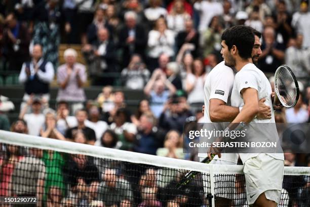 Spain's Carlos Alcaraz shakes hands with France's Jeremy Chardy after winning in their men's singles tennis match on the second day of the 2023...