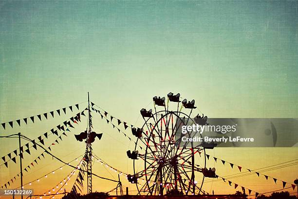 carnival at sunset - big wheel stock pictures, royalty-free photos & images