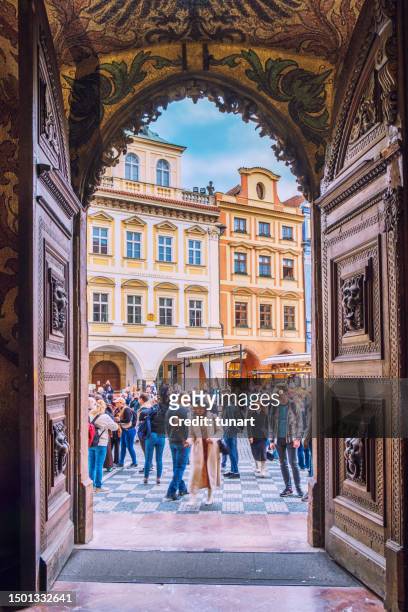 crowd in prague old town square from through the portal of prague town hall - stare mesto stock pictures, royalty-free photos & images