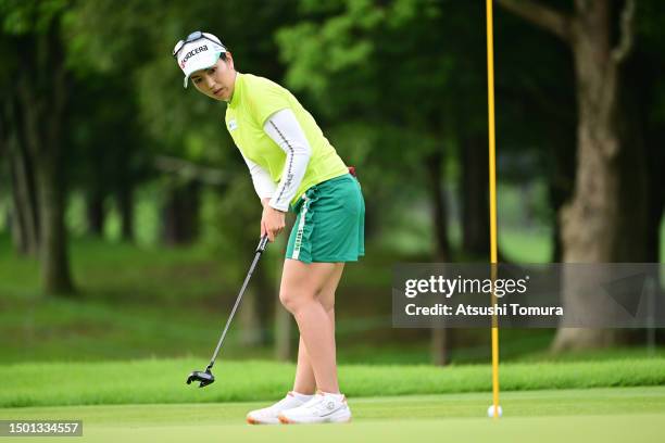 Ritsuko Ryu of Japan holes the birdie putt on the 1st green during the final round of Earth Mondahmin Cup at Camellia Hills Country Club on June 25,...