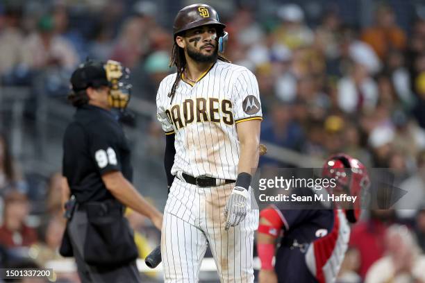 Fernando Tatis Jr. #23 of the San Diego Padres reacts to striking out during the eighth inning of a game against the Washington Nationals at PETCO...