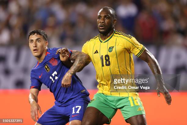 Alejandro Zendejas of United States battles for position with Michail Antonio of Jamaica during the Group A match between United States and Jamaica...