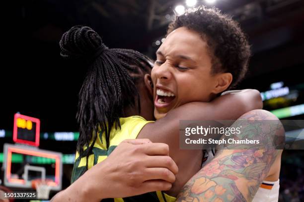 Jewell Loyd of the Seattle Storm and Brittney Griner of the Phoenix Mercury embrace after the game at Climate Pledge Arena on June 24, 2023 in...