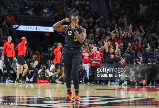 Chelsea Gray of the Las Vegas Aces reacts after making a behind-the-back pass to A'ja Wilson for an assist against the Indiana Fever in the fourth...