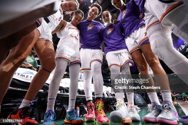 Brittney Griner of the Phoenix Mercury makes a funny face as she gathers with teammates before the game against the Seattle Storm at Climate Pledge...