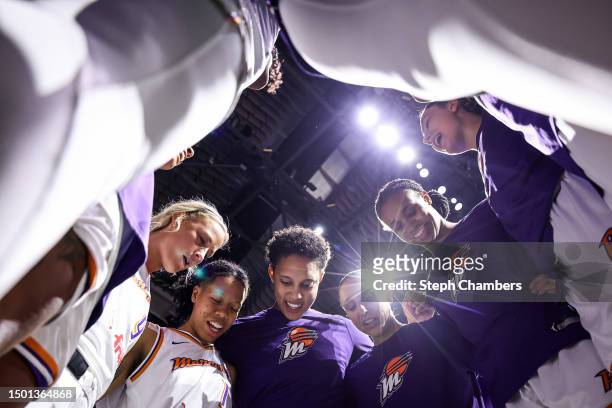 Brittney Griner and Diana Taurasi of the Phoenix Mercury gather their teammates before the game against the Seattle Storm at Climate Pledge Arena on...