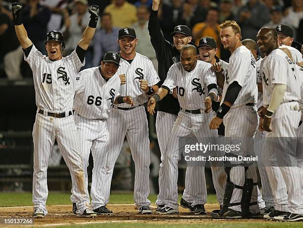 Members of the Chicago White Sox including Gordan Beckham, Ray Olmedo, Tyler Flowers and Alexei Ramirez, welcome Jordan Danks who hit a walk-off home...