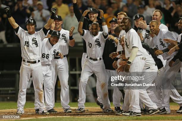 Members of the Chicago White Sox including Gordan Beckham, Ray Olmedo, Tyler Flowers and Alexei Ramirez, welcome Jordan Danks who hit a walk-off home...