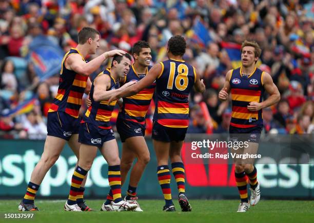 Ian Cullinan of the Crows is celebrates kicking a goal with team mates during the round 20 AFL match between the Adelaide Crows and the Fremantle...