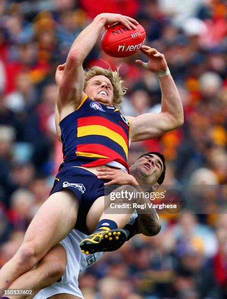 Rory Sloane of the Crows marks over Clancee Pearce of the Dockers during the round 20 AFL match between the Adelaide Crows and the Fremantle Dockers...