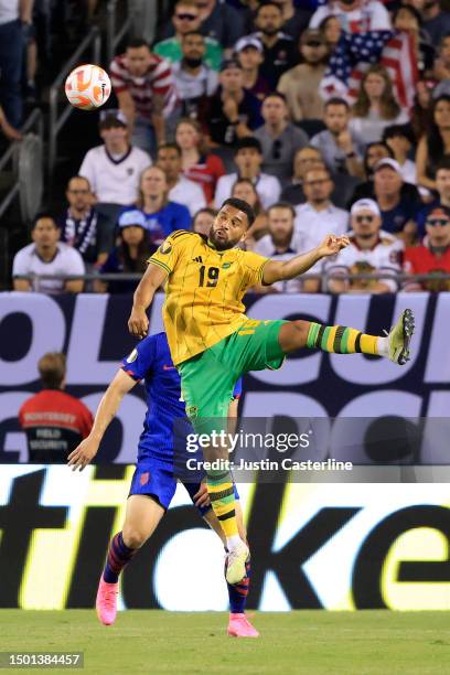 Adrian Mariappa of Jamaica heads the ball during the first half in the game against the United States during the Concacaf Gold Cup Group Stage at...