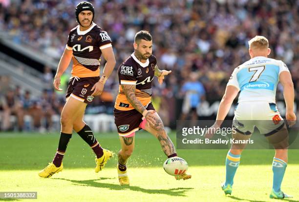 Adam Reynolds of the Broncos puts a kick through during the round 17 NRL match between Brisbane Broncos and Gold Coast Titans at Suncorp Stadium on...