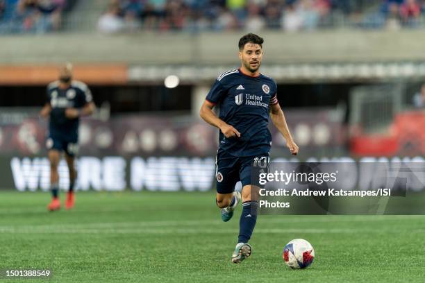 Carles Gil of New England Revolution brings the ball forward during a game between Toronto FC and New England Revolution at Gillette Stadium on June...