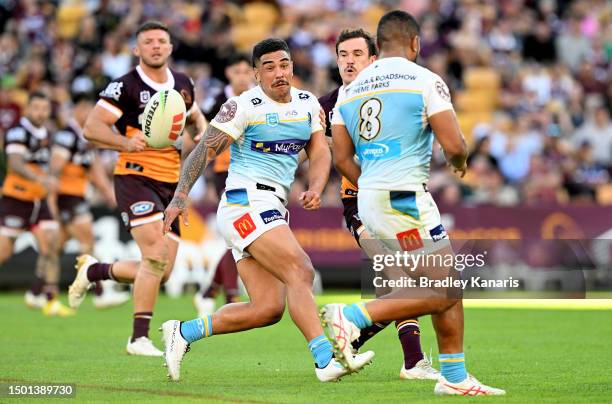 Erin Clark of the Titans passes the ball during the round 17 NRL match between Brisbane Broncos and Gold Coast Titans at Suncorp Stadium on June 25,...