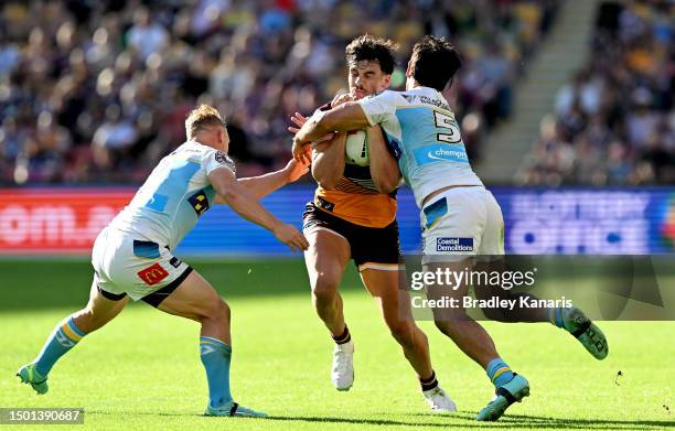 Herbie Farnworth of the Broncos takes on the defence during the round 17 NRL match between Brisbane Broncos and Gold Coast Titans at Suncorp Stadium...