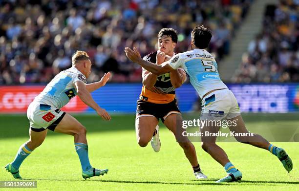 Herbie Farnworth of the Broncos takes on the defence during the round 17 NRL match between Brisbane Broncos and Gold Coast Titans at Suncorp Stadium...