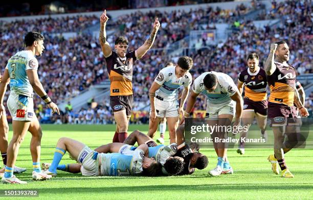 Ezra Mam of the Broncos scores a try during the round 17 NRL match between Brisbane Broncos and Gold Coast Titans at Suncorp Stadium on June 25, 2023...