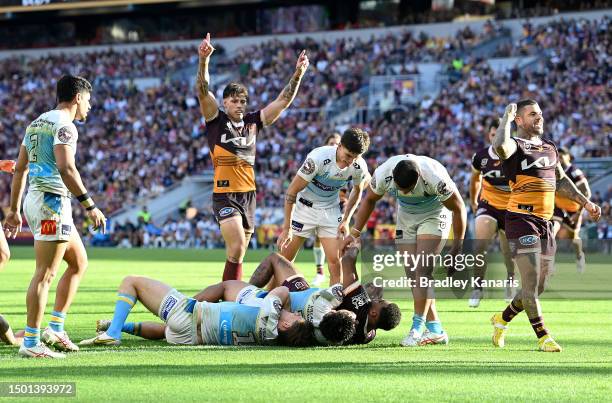 Ezra Mam of the Broncos scores a try during the round 17 NRL match between Brisbane Broncos and Gold Coast Titans at Suncorp Stadium on June 25, 2023...