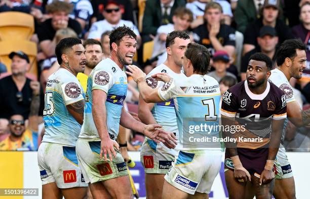 Brimson and Joe Stimson of the Titans celebrate during the round 17 NRL match between Brisbane Broncos and Gold Coast Titans at Suncorp Stadium on...