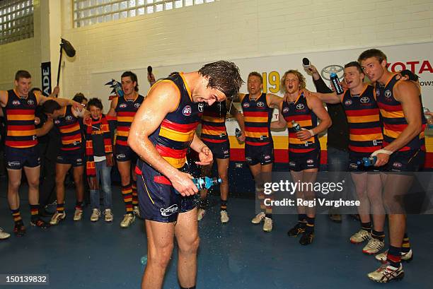 Lewis Johnston of the Crows celebrates with team mates after their victory during the round 20 AFL match between the Adelaide Crows and the Fremantle...