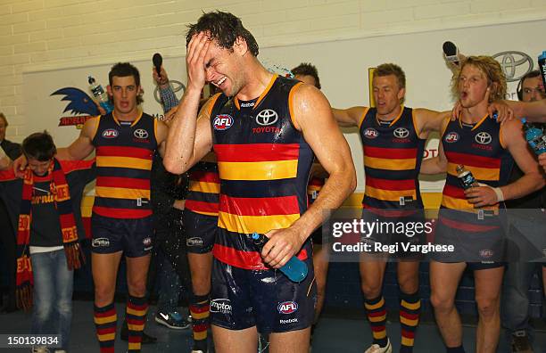 Lewis Johnston of the Crows celebrates with team mates after their victory during the round 20 AFL match between the Adelaide Crows and the Fremantle...