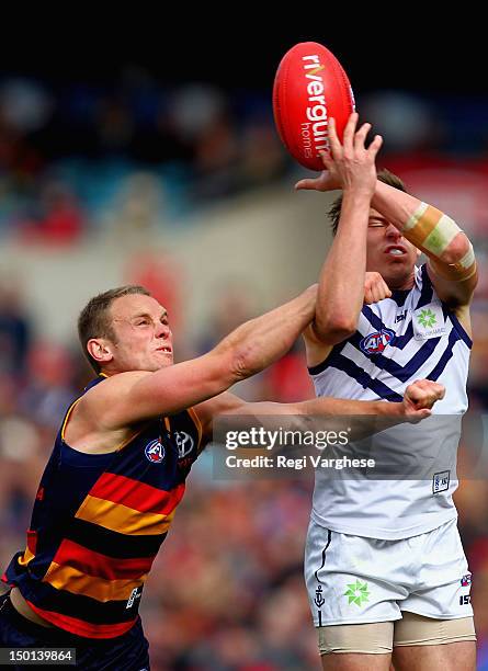 Nick Suban of the Dockers marks over Brent Reilly of the Crows during the round 20 AFL match between the Adelaide Crows and the Fremantle Dockers at...