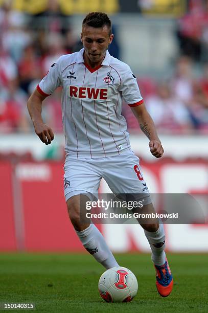 Adam Matuschyk of Cologne controls the ball during the Second Bundesliga match between 1. FC Koeln and SV Sandhausen at RheinEnergieStadion on August...