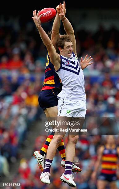 Michael Barlow of the Dockers and Richard Douglas contest a mark during the round 20 AFL match between the Adelaide Crows and the Fremantle Dockers...