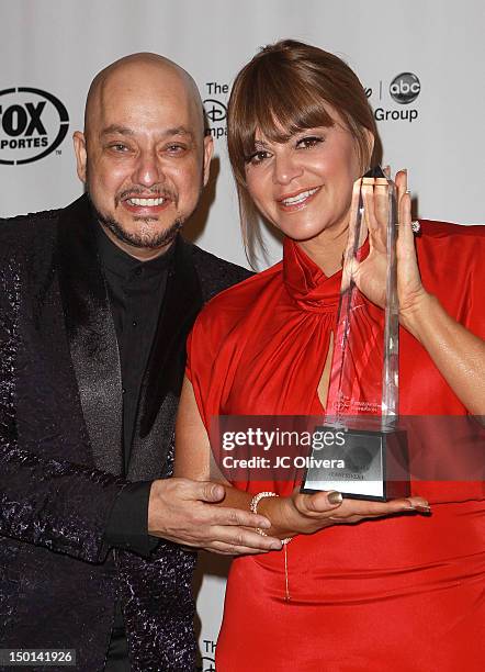 Singer Jenni Rivera poses with her 'Presidents Award' with Radio Program Director Pepe Garza during the 27th Annual Imagen Awards at The Beverly...