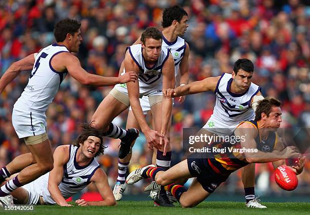 Richard Douglas of the Crows under pressure during the round 20 AFL match between the Adelaide Crows and the Fremantle Dockers at AAMI Stadium on...