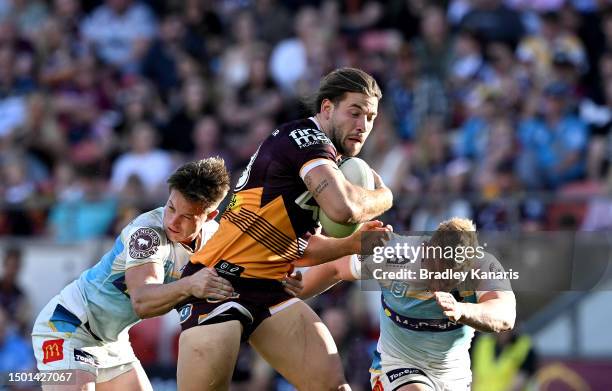 Patrick Carrigan of the Broncos takes on the defence during the round 17 NRL match between Brisbane Broncos and Gold Coast Titans at Suncorp Stadium...