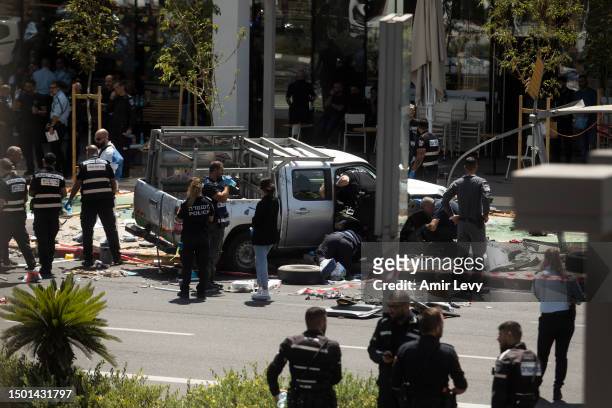 Israeli security and rescue forces examine the scene of a terror attack on July 4, 2023 in Tel Aviv, Israel. Several people were injured after a car...