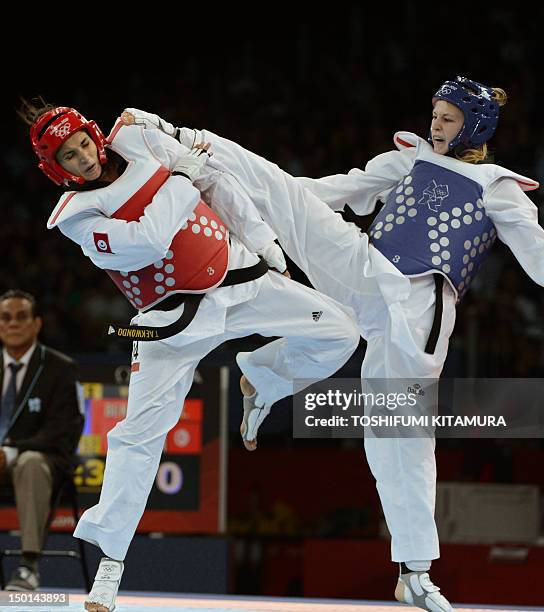 Russia's Anastasiia Baryshnikova fights against Tunisia's Khaoula Ben Hamza during their women's taekwondo bout in the + 67 kg category as part of...