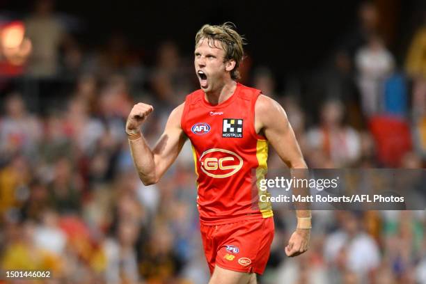 Jack Lukosius of the Suns celebrates kicking a goal during the round 15 AFL match between Gold Coast Suns and Hawthorn Hawks at Heritage Bank...